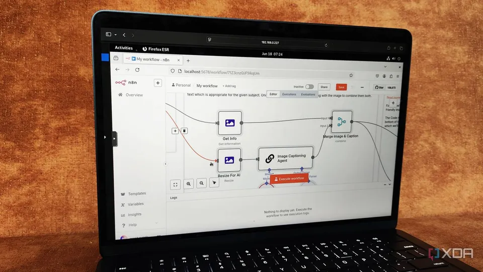 A laptop showing a self-hosted n8n workflow in the editor (XDA Developers photo)